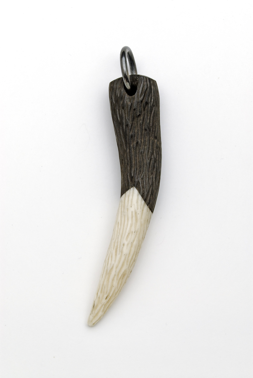 Jane Dodd, 14 Bits, Pendant: Black/White Tooth, 2014, Lignum vitae, dye, sterling silver, 8.8 x 5.8 x 2.2 cm